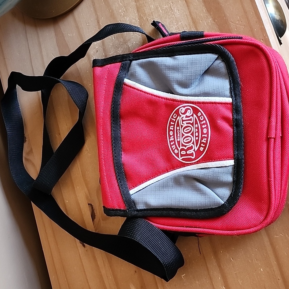 ROOTS red and black crossbody bag